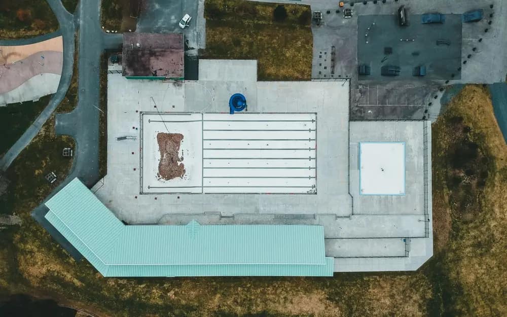 Aerial view of a flat, low-slope commercial roofing system